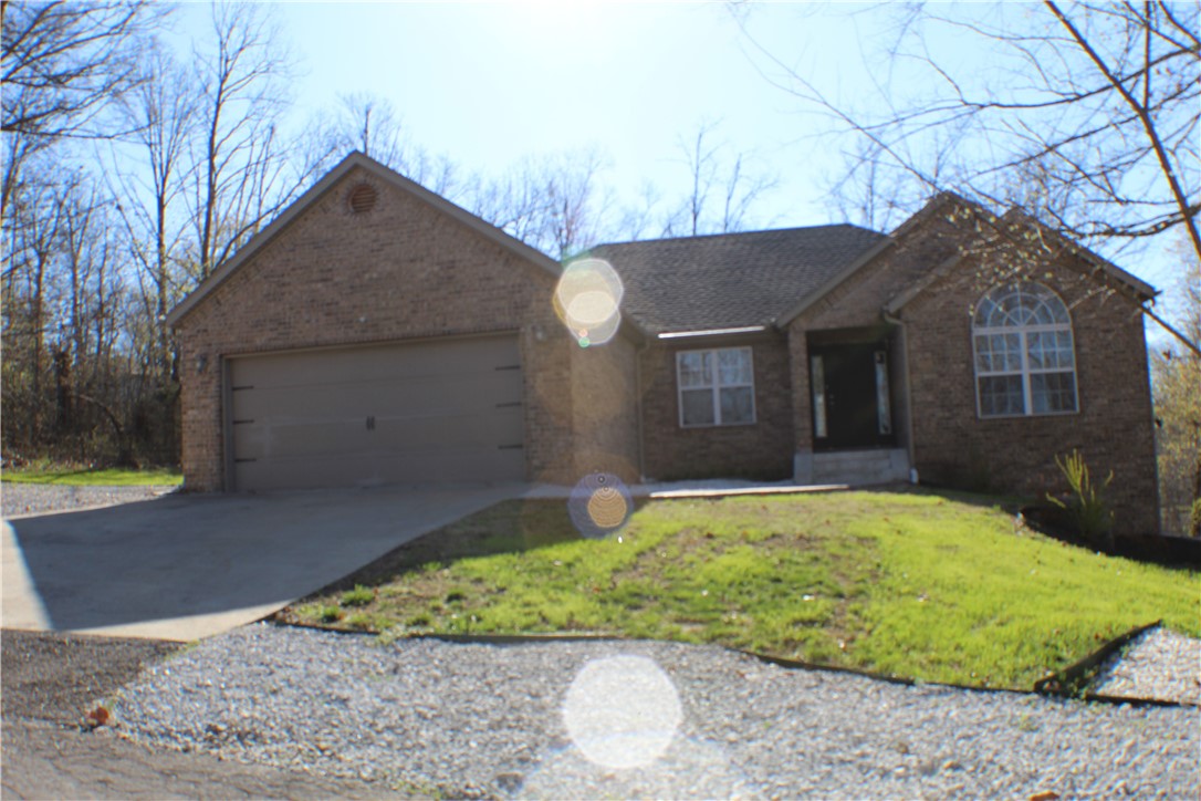 Calling all outdoor enthusiasts! This gorgeous rental home is located across the street from lake front homes on Lake Windsor! Bring your kayaks or mountain bikes and enjoy the calm waters of the lake or the numerous bike trails close by. When you walk up to the front door, you are greeted by the lovely flower bed. Inside was beautifully remodeled in 2018. Soaring ceilings, new light fixtures, wood floors, granite counters, stainless steel appliances and one-touch faucet in kitchen. Split bedroom floor plan. Master suite with tray ceiling and en suite bath featuring a large walk-in closet, dual vanity, two person Jacuzzi tub and separate walk-in shower. Outside entertaining will be nice and cozy around the firepit. All of this located in the Bentonville School District!