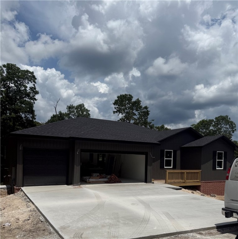 Beautiful New Construction home in Bella Vista close to Loch Lomond. This stunner is a 2 bedroom with an extra room or office, 2.5 bath home and has storage galore. Abundant natural light in the spacious living room. Decorative fireplace framed by built in's and floating shelves. Gorgeous, open kitchen with a large island for entertaining. Split floor plan with a large master suite. Master bathroom with a free standing tub and custom tile shower. Large master walk-in closet that leads to the laundry room. Half bath close to the entry for guests. Custom cabinetry & woodwork with a mixture of Quartz and Granite countertops throughout the home. Beautiful modern light fixtures and cabinet hardware. Smart thermostat for energy efficiency. The exterior has a Ring Doorbell, custom cedar shutters, covered deck, & attached 3 car garage. Home will be completed in 45 days or less. Close proximity to Bike/Hiking Trails, Rec Centers, Golf Courses, and Lakes!!! 2 bedroom septic.