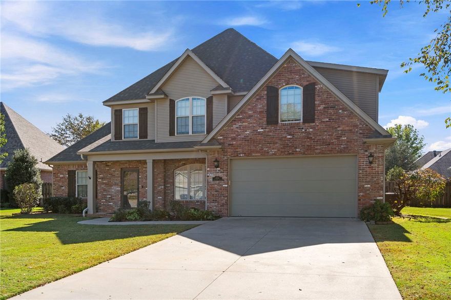 Stunning 5 BR 3 BA home just minutes from I-49 and conveniently located to all Fayetteville has to offer. Situated on a friendly cul-de-sac right by Clabber Creek Trail (paved, multi-use) which leads to the Razorback Greenway. This immaculately kept home was freshly painted with new carpet in 2023. Used as a second home by owners for out-of-town visits, so the paint and carpet still look new. Gorgeous real hardwood floors throughout main downstairs living areas were refinished in 2025. Kitchen features custom cabinetry, granite countertops, stainless appliances, gas cooktop, new vent hood, and double ovens. Laundry room includes extra cabinets, large sink, and fixed clothes rod. Master suite is spacious, and the master bath has a large walk-in closet with custom built-ins and LED lighting. Upstairs offers two bedrooms with a jack-and-jill bath and a grand bonus room or 5th bedroom. Backyard is fully fenced. Enjoy relaxing under the covered porch with extended patio.