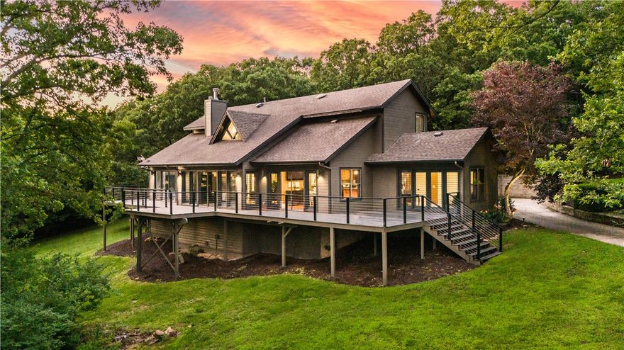 Your dream home awaits! Nestled on over 3 acres, this stunning residence offers privacy without sacrificing accessibility. Step inside to soaring ceilings in the living room, complete with built-ins and a beautiful fireplace. The open concept kitchen boasts a large island with stone countertops and a lovely view to all areas of the home. Adjacent to the kitchen, the dining area seamlessly flows onto a large deck that spans the entire backside of the home, providing ample outdoor living space. The primary suite is conveniently located on the main level. Additional spaces include a reading nook and a dedicated office area. Outside, the beautifully landscaped yard features a pool with a saltwater converting option, and a large re-done deck allowing for ample room for activities. A new fence and gate, along with retaining walls, enhance the property’s appeal and functionality. With a serene atmosphere and plenty of room to entertain, yet located minutes from town, this charming home is truly a sanctuary.