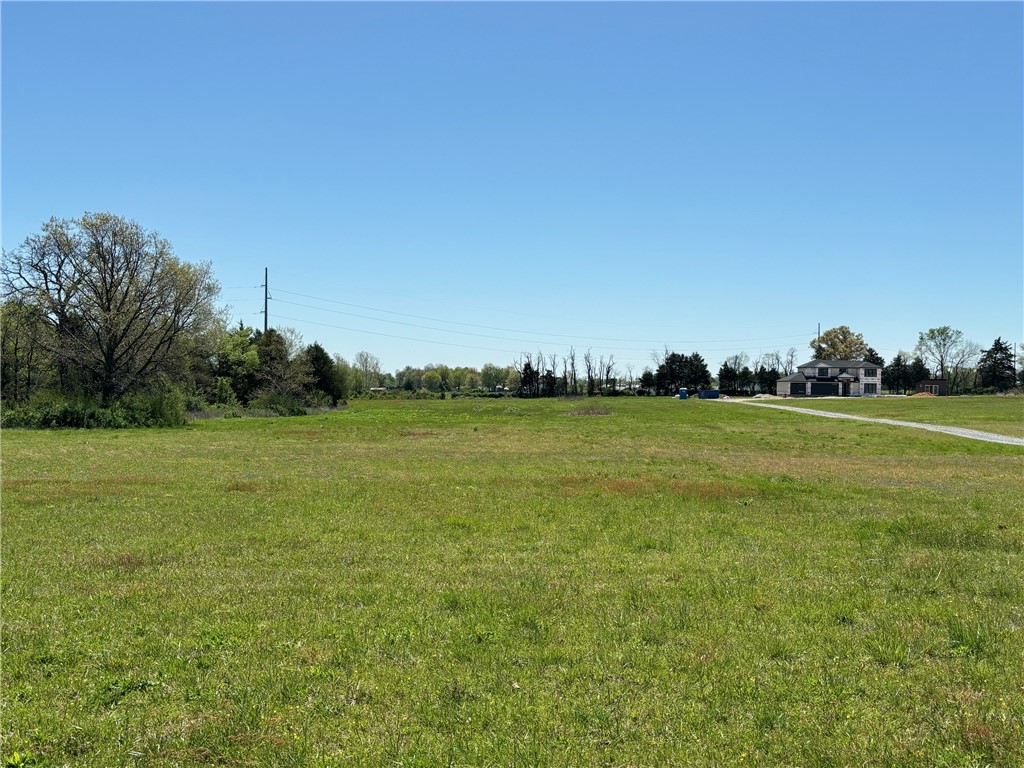 Fabulous Flat Acreage! Perk test has already been completed. Septic needed. Water and Electricity at the street. Perfect location to build your dream home. Located in Highfill city limits, Bentonville School District, Survey, Perc Test & approved Septic Plan for 4 bedrooms available. Address works in Google Maps