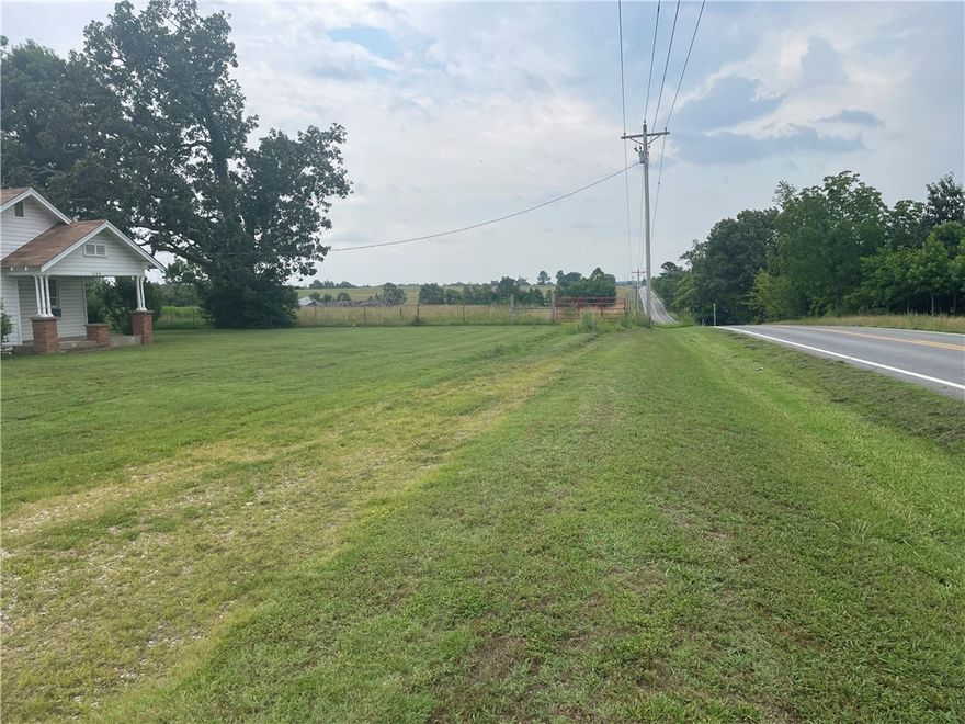 48.73 acres Located on Hwy 264 West of Cave Springs just past entrance to XNA airport.  HUGE PRICE REDUCTION. 48.73 Acres joins XNA Airport on 2 sides. 1529 feet frontage on Hwy 264 & 645 feet frontage on Pianalto Road.  Great Development potential. Older home and Barn on property but has no value. The new access road to XNA airport being built from US 412 Northern Bypass will give this property more accessibility to Northwest Arkansas and major highway arteries. (Parcel#22-00076-000)