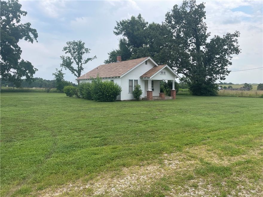 48.73 acres Located on Hwy 264 West of Cave Springs just past entrance to XNA airport.  HUGE PRICE REDUCTION. 48.73 Acres joins XNA Airport on 2 sides. 1529 feet frontage on Hwy 264 & 645 feet frontage on Pianalto Road.  Great Development potential. Older home and Barn on property but has no value. The new access road to XNA airport being built from US 412 Northern Bypass will give this property more accessibility to Northwest Arkansas and major highway arteries. (Parcel#22-00076-000)