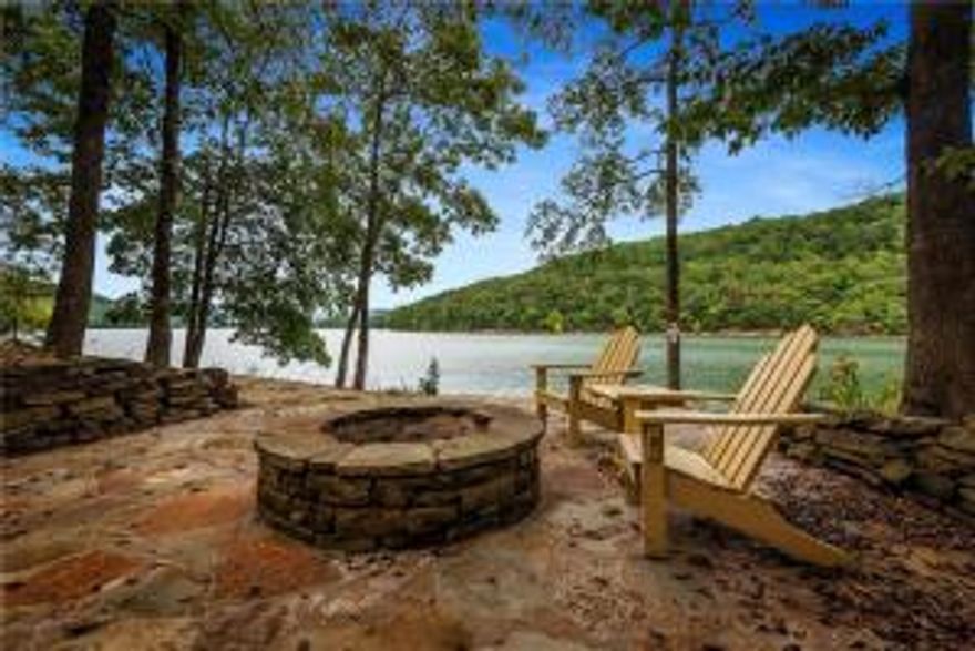 This stunning property offers all the dream lakefront features! The spacious home welcomes you with light airy rooms, high ceilings, open floor plan and designer finishes. The elevator allows everyone easy access to all 3 levels. Expansive outdoor spaces invite you to enjoy the lake at every opportunity and the low corp line gives easy access to the private 4 slip dock and the waterfront and firepit area. See attached features sheet for full list of amenities