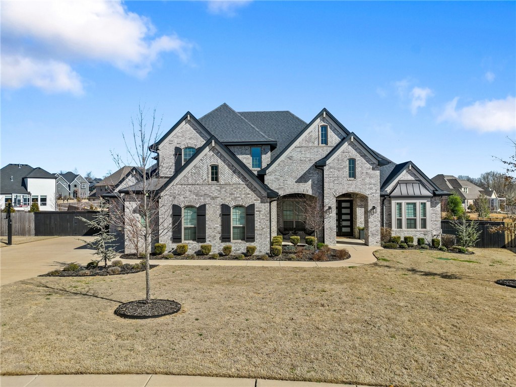 Welcome to your dream home in the heart of Otter Creek, one of the most sought-after subdivisions in Benton County! This spectacular newer home offers a perfect blend of luxury, comfort, and convenience.
As you step inside, you'll be captivated by the open floor plan flooded with natural light, courtesy of large windows and soaring cathedral ceilings. The large living area connects to a custom kitchen with custom white cabinets, granite countertops, and a large pantry. The main floor features a formal dining area and a study off the entry, providing versatile spaces. The owner suite is a retreat with its own ensuite bathroom. This home includes a large bonus room, complete with a theater screen and projector – the perfect spot for movie nights or entertaining.This residence is just a quick walk from all the community spaces, including a pool and sports courts. Enjoy being close to all the best shopping and restaurants, making every day a delight. Additionally, a quick drive to XNA ensures that travel is a breeze.