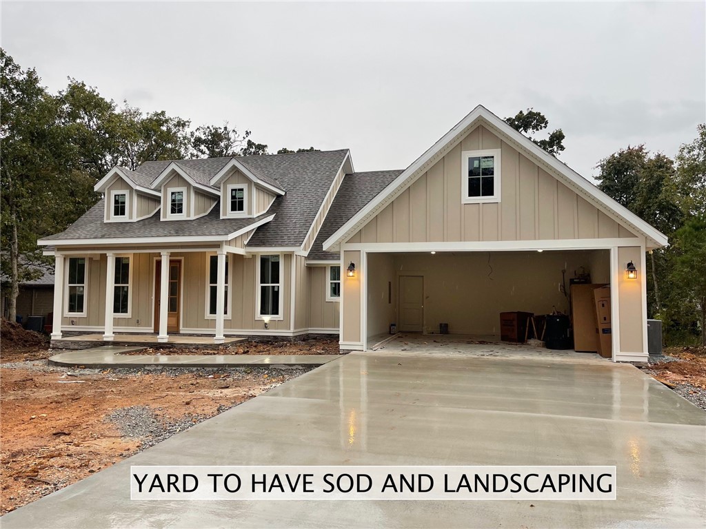 This 1,950 sq foot home has 4 bedrooms and 2 baths. Home features: Large great room with fireplace, elegant kitchen, Custom cabinets throughout house with quartz countertops. Master bath includes freestanding tub, shower, and massive walk in closet. Extra finishes include stack stone, covered front and back porches, crown molding, and much more. This beautiful home sits on .25 acre lot, in Bella Vista, AR. It has City Sewer, Water, electric and Propane. The sod will be laid in the next couple weeks. Home includes a *1 year limited builders warranty