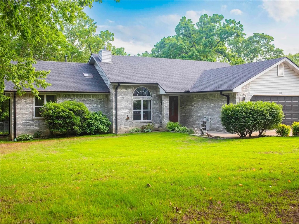 Charming brick home in a desirable neighborhood, featuring dual master suites with spacious walk-in closets. Enjoy a private, fenced backyard with a storage shed, backing to a peaceful wooded lot. A large covered deck is perfect for bird watching or hosting barbecues, surrounded by beautiful flower gardens. Inside, a brand-new gas fireplace insert adds warmth and charm to the living area. Sleek laminate flooring flows throughout the home, which has been meticulously maintained and is truly move-in ready. Major updates include a roof replaced just three years ago, a newer AC unit, and a brand-new water heater for added peace of mind.