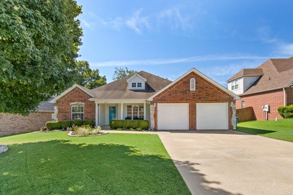 You will love the flow of this split floor plan. Light and bright and ready for you. Enjoy sitting on the quiet front porch with a cup of morning coffee, cozy up to the fire this winter in the large living room. Spacious laundry with overflow storage, large master suite with jetted tub perfect to relax the day away, covered back patio, updated flooring, paint and so much more. Great Bentonville location with easy access to all of NWA.