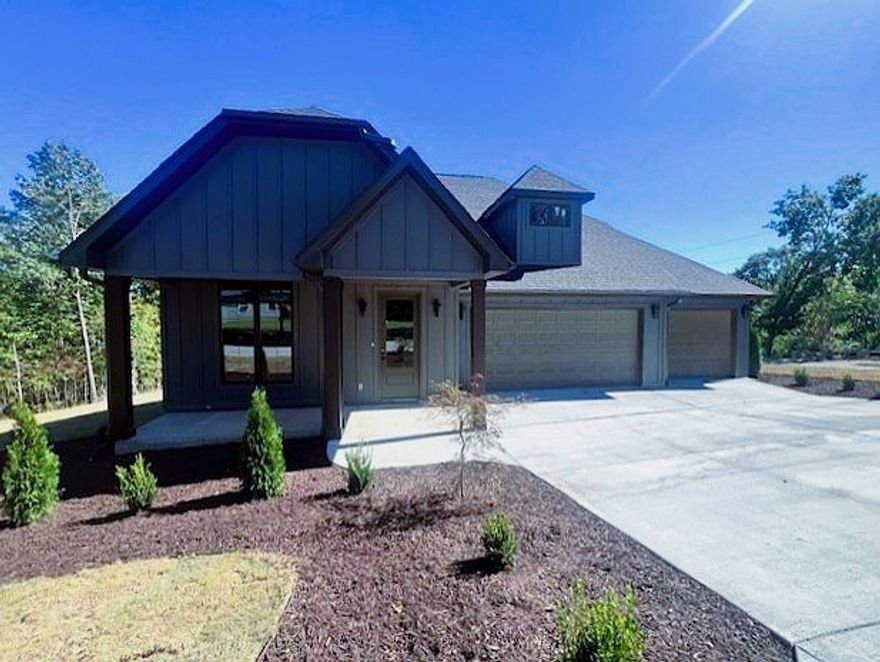 New Construction Home nearing completion! Located minutes from Golf and Branchwood Rec Center and Filled with stunning upgraded features: High-end Quartz counters throughout, white oak cabinets on Kitchen Island and in Primary Bath, Built-In Beverage Center with undercounter wine/bev fridge, and a gorgeous, covered deck with integrated heaters to keep you warm in those chilly Winter months! This home features 3 Bedrooms, 2.5 baths plus an office, abundant storage and customs built-ins, a spacious 3-car garage and it's on a double lot for a total of .69 acres! Come see this one today.