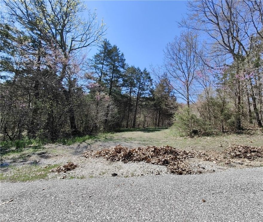 Ready for a vacation get-a-way?? This lot is ready for your weekend retreat! All utilities are at the street! Come enjoy swimming, boating, fishing, golf, etc. within minutes of your new residence. Eureka Springs is just a few miles away for shopping and special events. Holiday Island is a exceptional place to unwind and relax. Come checkout this amazing lot and build your dream home!