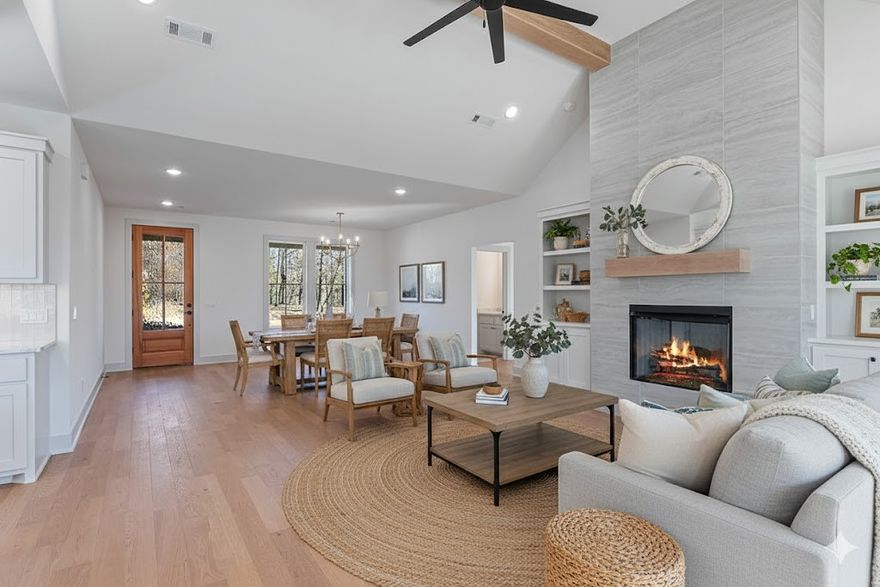 Welcome home! Discover the refined charm of modern farmhouse living in this newly constructed residence, thoughtfully crafted by a distinguished local builder. Designed with open-concept concept that seamlessly blends rustic warmth with chic, contemporary finishes. The heart of the home- large kitchen featuring a pantry, a waterfall prep island with quartz countertops & a gas range. Kitchen sink overlooks the backyard and has a dedicated side bank of buffet cabinets for extra storage. The living room, centered around a fireplace with mantle, is lit up by elegant champagne gold lighting. Living room transitions to a 10x16 covered back deck, complete with a gas hookup—perfect for entertaining. The primary retreat offers a spa-inspired ensuite with a soaker tub, a fully tiled walk-in shower and a generous walk-in closet. Upstairs, discover a versatile 13x15 bonus landing, a dedicated home office, two guest bedrooms & full bath. Located minutes from Bella Vista’s world-class mountain bike trails, golf, and lakes.