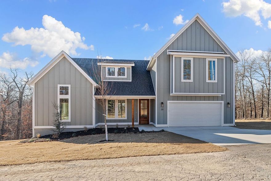Welcome home! Discover the refined charm of modern farmhouse living in this newly constructed residence, thoughtfully crafted by a distinguished local builder. Designed with open-concept concept that seamlessly blends rustic warmth with chic, contemporary finishes. The heart of the home- large kitchen featuring a pantry, a waterfall prep island with quartz countertops & a gas range. Kitchen sink overlooks the backyard and has a dedicated side bank of buffet cabinets for extra storage. The living room, centered around a fireplace with mantle, is lit up by elegant champagne gold lighting. Living room transitions to a 10x16 covered back deck, complete with a gas hookup—perfect for entertaining. The primary retreat offers a spa-inspired ensuite with a soaker tub, a fully tiled walk-in shower and a generous walk-in closet. Upstairs, discover a versatile 13x15 bonus landing, a dedicated home office, two guest bedrooms & full bath. Located minutes from Bella Vista’s world-class mountain bike trails, golf, and lakes.