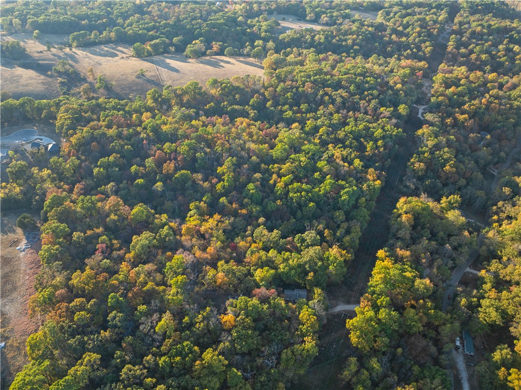 Discover over 29 acres of prime land offering endless possibilities! Located off Rader Road, this expansive property features two 50' ingress/egress easements, ensuring easy access for future development. Whether you're looking to build your dream home with privacy and space or develop multiple homes, this property provides the perfect setting. Enjoy the beauty of nature while staying conveniently close to local amenities. Don't miss this rare opportunity to own a versatile piece of land in a growing area! The flexibility of the surveyed layout, offering 5-6 acre options, makes it perfect for personal use or development, whether for a dream home, a subdivision to name a few.
The lack of restrictions and access to rural water are huge advantages for potential investors. Plus, the proximity to Big Sugar Golf Club will attract outdoor enthusiasts, enhancing its appeal. This unique blend of privacy and convenience could lead to many exciting possibilities!
