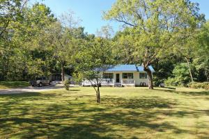 Nice 3 bedroom 2 bath on 6 acres m/l. Private setting, outbuildings, Masonite siding, spacious living area and much more.
