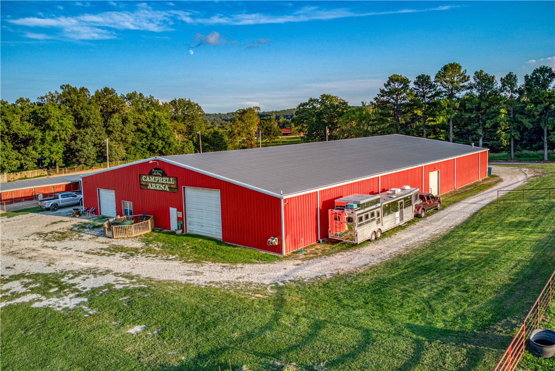 Welcome to 4964 Maris Loop in Harrison, Arkansas, a premier equestrian farm that combines functionality, beauty, and comfort. Spanning 14 picturesque acres, this property is a horse enthusiast’s dream, featuring both indoor and outdoor riding arenas, 15 indoor horse stalls, and ample space to accommodate 45-50 horses. Perfectly suited for professional boarding services, the facility is designed to meet the highest standards for equestrian care. The property also includes a charming 1,000-square-foot living quarters with one bedroom, one bathroom, and a full kitchen, offering cozy and convenient accommodations in a serene setting. Whether you're looking to expand your equestrian business or create a private haven for your horses, this property is a must-see!