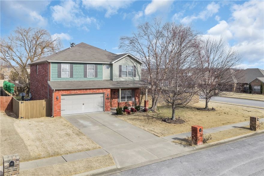 Welcome to 5001 Bay Court in desirable Lakewood Crossing! This beautiful 4-bedroom, 2.5-bath home offers 2,815 square feet on a corner lot. Built in 2012, the home features granite counters, built-ins, and a gas fireplace. The spacious, eat-in kitchen includes two ovens and a pantry. Enjoy the stained concrete patio overlooking your private, wood-fenced backyard—ideal for relaxing after a bike ride on the nearby Razorback Greenway. Downstairs boasts hardwood floors and walk-in closets. Location is everything! Walk  to Janie Darr Elementary, making drop-offs easy. You're minutes from Pinnacle Hills shopping, dining, and entertainment. With mature landscaping and a fantastic Rogers location, this home offers the complete package. Don't miss this opportunity to own in Northwest Arkansas's most sought-after neighborhoods!