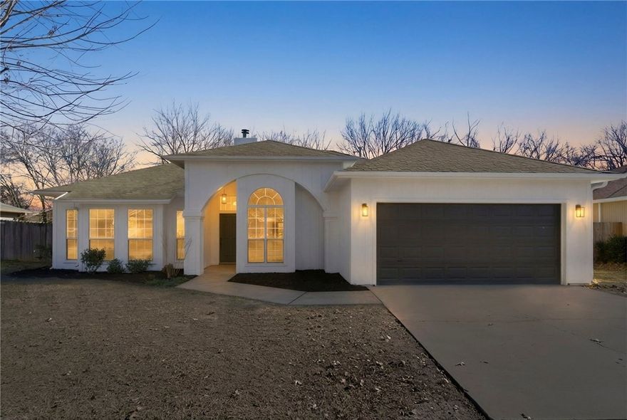 A true showstopper from the moment you walk in! This fully remodeled 3-bedroom, 2-bath home offers an open layout with two living areas, elegant architectural details, and a cozy fireplace. The designer kitchen features quartz countertops, updated cabinetry, and all-new stainless appliances. Unwind in the spa-like primary suite with a freestanding soaking tub and double vanity. Fresh finishes throughout, a mudroom laundry combo that adds everyday convenience, and a covered back patio perfect for entertaining make this home completely move-in ready. Schedule your showing today—this one won’t last!