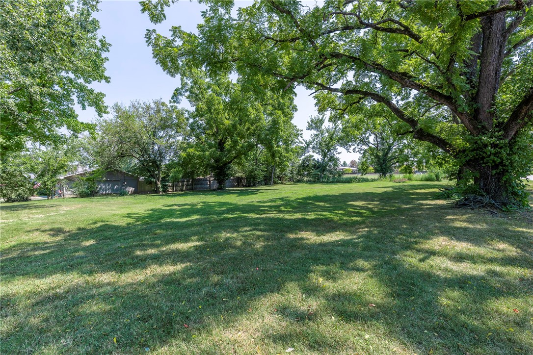 Seize this incredible opportunity to own a 0.34-acre interior corner lot in one of the most sought-after locations in Northwest Arkansas! This flat, mostly cleared, and buildable lot offers the ideal canvas for your dream home or investment project. Zoned R1 and ready for your vision, with utilities conveniently located at the street. Whether you're a builder, investor, or future homeowner, you'll love the unbeatable location, less than a mile from the new Walmart Headquarters and vibrant Downtown Bentonville. Enjoy easy access to world-class trails, restaurants, arts, and entertainment, all while being tucked into a quiet residential setting. Don't miss out on the chance to build in the heart of it all!