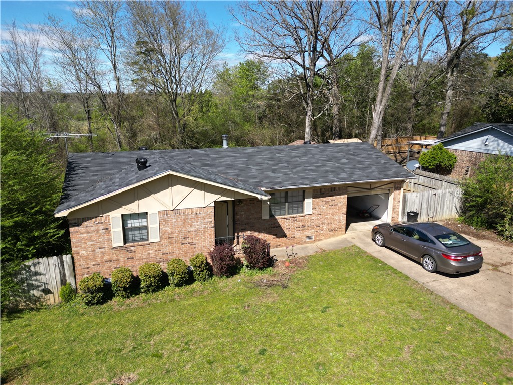 Attractive Opportunity for Investors or first time home buyers: Cozy 2-Bedroom, 1-Bathroom Home near the University of the Ozarks in Clarksville, AR. Each bedroom offers generous space, providing a personal sanctuary for comfort and privacy. This charming home comes complete with a single-car garage, ensuring your vehicle stays clean and secure. The home boasts a covered patio in the backyard, offering a blank canvas for you to personalize and transform into your own unique oasis. It has a new roof and new paint throughout. Additionally, the property features a storage building that provides ample space for storage or can be utilized as a workshop, catering to your creative or practical needs.