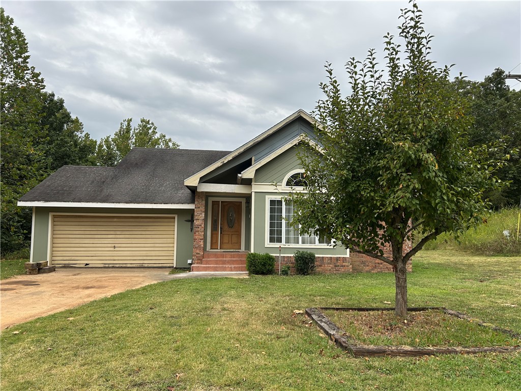 Don't miss this opportunity to own a 5 acre parcel so close to town on a paved road. Less than 3 miles to Hwy 16. The home was custom built and has had just one owner. Some TLC is needed such as paint, trim work and a new garage door. Carpet in just 2 bedrooms - elsewhere the tile and laminate are in very good condition. The kitchen cabinets are custom hand made. Fireplace in the living room uses propane. Plenty of storage space in the house and garage. Large linen closet plus nice storage shelving in the main bathroom. Patio doors open from the 1st bedroom to a spacious deck - a lovely spot to watch the wildlife. There is a 20' x 12' storage building. A wet weather creek runs across the property. Lots of potential here to spread out and add your personal touches. Sold as is!