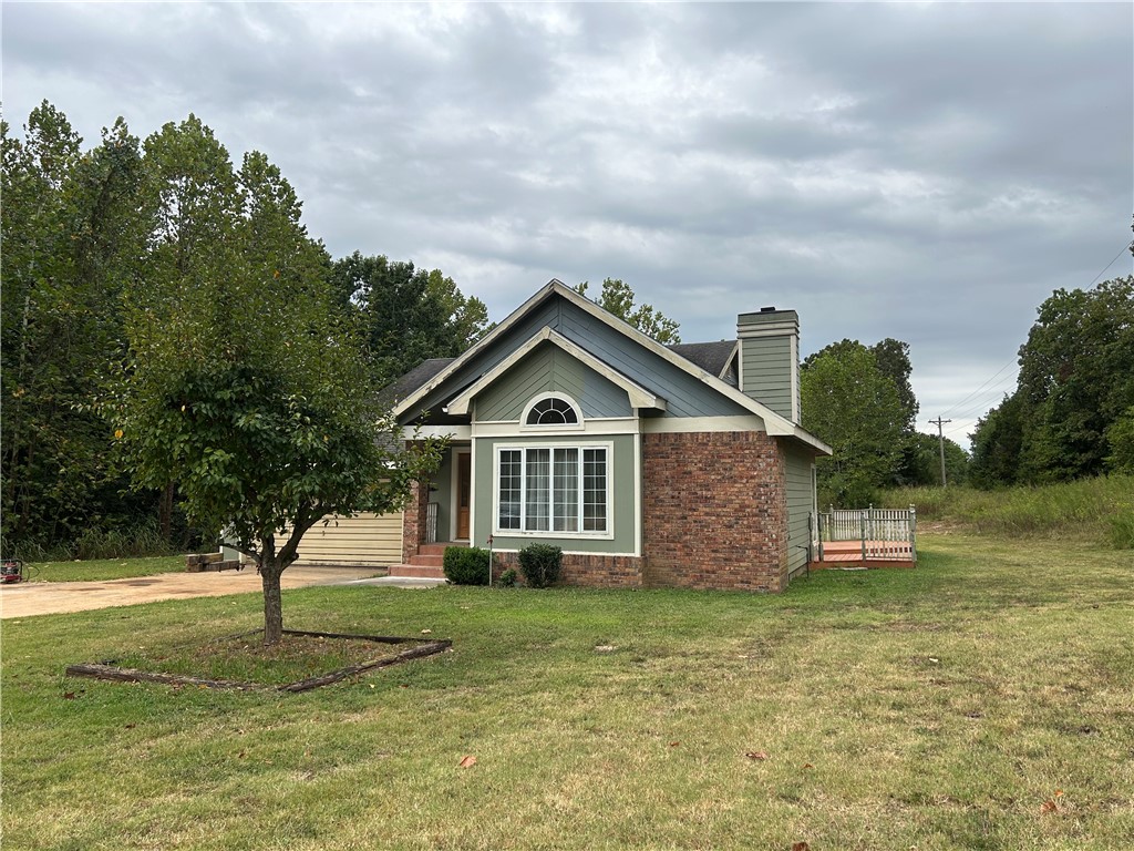 Don't miss this opportunity to a own a 5 acre parcel so close to town on a paved road. The home was custom built and has had just one owner. Some TLC is needed such as some paint, trim work and a new garage door. Carpet in just 2 bedrooms - elsewhere the tile and laminate are in very good condition. The kitchen cabinets are custom hand made. Fireplace in the living room uses propane. Plenty of storage space in the house and garage. Large linen closet. Patio doors open from the 1st bedroom to a spacious deck - a lovely spot to watch the wildlife. There is a large storage building. A wet weather creek runs across the property. Lots of potential here to spread out and add your personal touches.