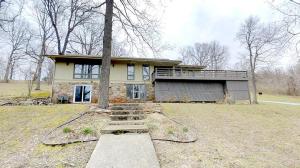 Great country subdivision at edge of town. Beautiful setting with large 3.65 acre lot and mature trees compliment this spacious contemporary style ranch home. 2 large rooms in basement could be media room, game room, or large bedroom, etc. Large deck, workshop area, hardwood floors, very nicely updated. A Must See!