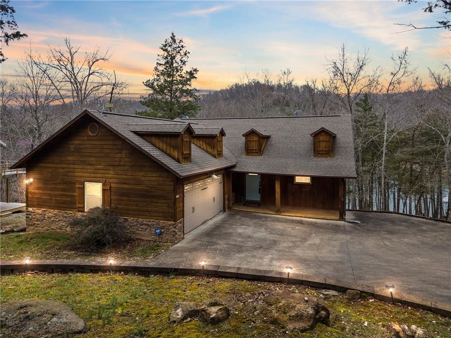 Escape to your own waterfront paradise with this stunning 3-bedroom, 2.5-bath lakefront home! Boasting 2 slips in a 4-slip dock, this 2,412 sq. ft. retreat offers easy lake access with a gentle walk to the water.

 Features You'll Love:
 Gourmet Kitchen – Granite countertops & plenty of space for entertaining
 Cedar Exterior – Rustic charm with timeless appeal
 Attached 2-Car Garage – Convenience & storage for all your lake toys
 Starlink Internet – Stay connected with high-speed satellite internet
 Prime Location – Enjoy breathtaking lake views & endless outdoor adventures
 Cable TV - YouTube TV
 Security System - ADT
 Concrete Drive from Paved Access Road

Don't miss this rare opportunity to own a piece of lakefront heaven—schedule your private showing today!