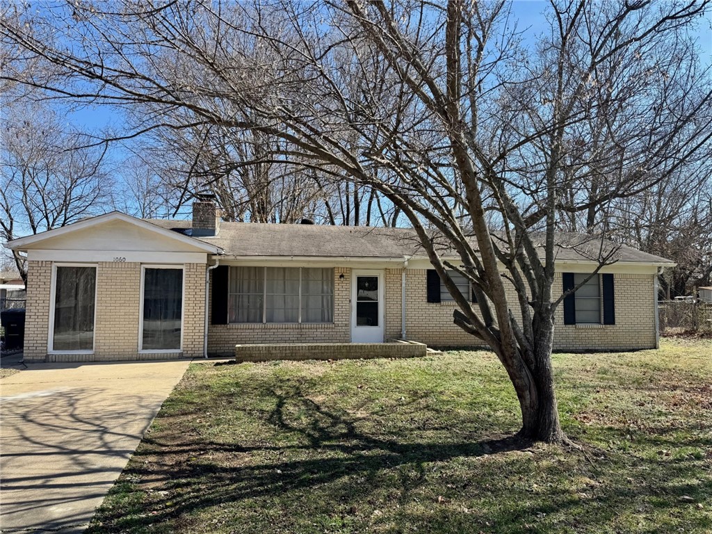 Cute home with lots of potential. Nearly one third of an acre lot with small shop or storage building. Home has a huge kitchen. Den with wood stove and living room with wood burning fireplace. New LVP flooring in living room, hall, and 2 bedrooms. Just minutes from Fayetteville, Lake Sequoyah or Elkins.