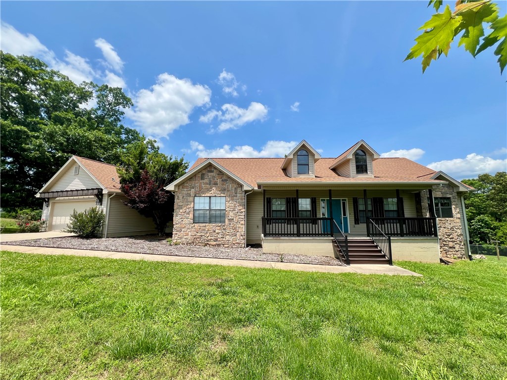 Welcome to this charming residence just off of Hwy 412 situated on 10.37 acres. This well-kept, 4 room total, consisting of 3 bedrooms and one office/study space is located in a quiet neighborhood at the end of a paved road. Enjoy the spacious primary bedroom with an en-suite including a walk-in shower and large jetted jacuzzi tub. The expansive deck, sunroom, and spacious backyard create an ideal setting for entertaining guests. The unfinished basement is perfect for equipment, lawn mowers and other storage. This type of property is rare and won't last long!