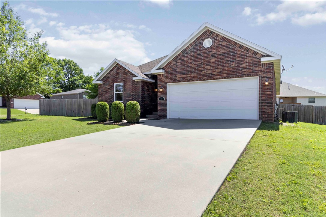 Great LOCATION! Easy access to everything. Perfect for a J.B. Hunt commute. Adorable, mostly brick, well maintained, 3/2/2, with tall ceilings, crown molding, spacious primary with large walk-in closet, separate shower and whirlpool tub, new interior paint throughout, new carpet in bedrooms, large corner lot in a quiet neighborhood just outside the hustle and bustle. Fully fenced backyard and covered back deck for a serene setting. Gas log fireplace inside with a gas starter for easy use on cool nights. Storage shed and refrigerator convey. HVAC 2022, Water Heater 2021, Seller Property Disclosure available. No POA.