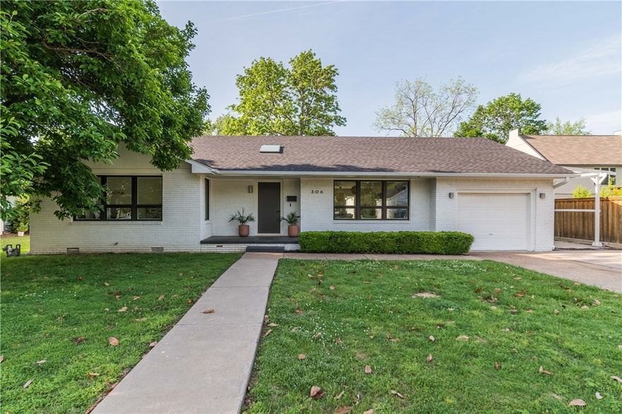 Yes. You can have it all. Check out this gorgeous Mid-Century Modern remodel in the heart of downtown Bentonville. Updates include all-new electrical, plumbing, HVAC, roof and gutters, open-cell foam insulation, drywall, factory-mulled aluminum-clad wood windows, all while preserving the original wood floors in living areas. Touches of elegance include period reclaimed interior doors, poplar trim, two skylights, and a vaulted ceiling in the master. Wow your dinner guests in the all new kitchen with book-matched walnut island, marble countertops, Bertazzoni 5-burner gas stove/oven and Viking fridge. Bathrooms and laundry feature quartz countertops and heated floor in main bath. Garage is insulated, heated and cooled to created a bonus space perfect for a gym, studio, or office. Large lot with driveway easement to back of property is perfect for building a pool, or perhaps an ancillary garage with an AirBnB loft above. Walking distance to the Square, Crystal Bridges, and easy access to the Slaughter Pen MTB trails.