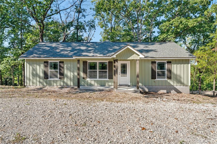 Nestled in the serene Ozarks, this newly constructed 3-bedroom, 2-bathroom home blends modern design with natural beauty. Spacious living areas feature large windows that flood the space with natural light and provide picturesque views of the surrounding landscape. Adjacent kitchen space offers plenty of room for customization, perfect for culinary creations and entertaining guests. Master suite provides a private retreat with an en-suite bathroom for comfort and convenience. Step outside to the back deck, ideal for relaxing while enjoying tranquil views of the property. Just minutes from Beaver Lake, easy access to boating, fishing, and hiking enhances outdoor living opportunities. Seller is open to offering assistance toward completing flooring and paint, giving buyers a chance to personalize the home.