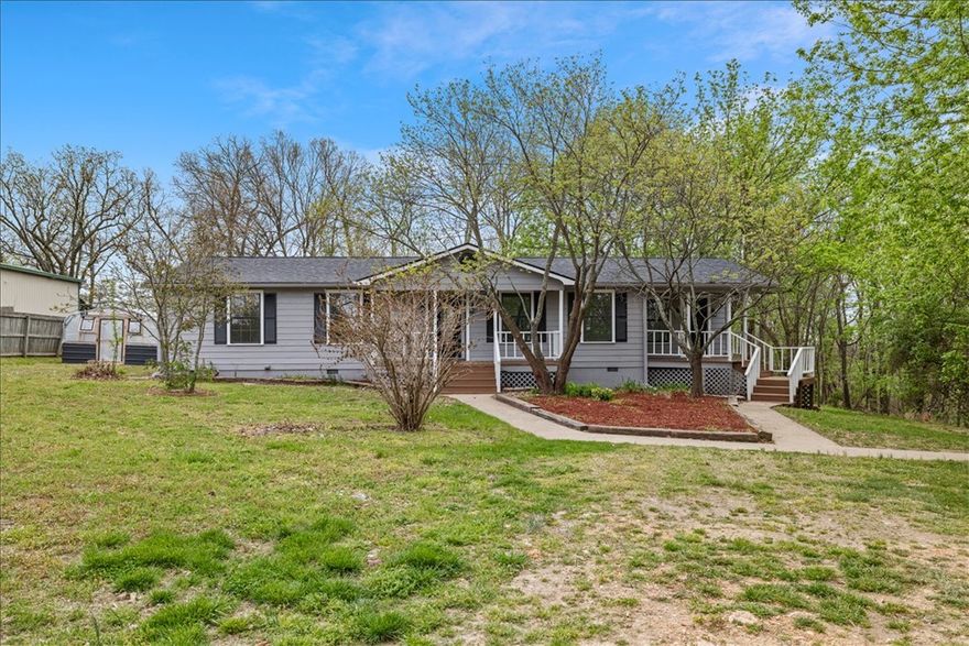 Tucked away on a spacious 0.69 acre lot, this inviting property offers privacy with a partially tree-surrounded setting and a peaceful, rural feel, yet it’s less than 3 miles from Arvest Ballpark, Blessings Golf Club, Arkansas Children's Hospital, Highlands Oncology, and Willow Creek Women's Hospital. Full of charm and opportunity, a separate room with its own exterior entrance provides exceptional flexibility for a home office, creative studio, or additional living space. The eat-in kitchen features new countertops, backsplash, range, plumbing fixtures, and vent hood, and it opens to a spacious deck through new French doors. Thoughtful updates include new flooring, paint, light fixtures, plumbing fixtures, and water heater, along with a roof replaced in 2023. With its blend of comfort, updates, and versatility, this move-in ready home is an excellent opportunity for first-time buyers or savvy investors alike.