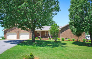 You will love this custom built home on over one acre with beautiful landscaping. Home includes a large shop building. There is a lot of room for a large family with another room in the basement that could be used for a fourth bedroom. You will enjoy sitting on the covered porch and the view from the sunroom. Home is in a great location less than 30 miles from Harrison. There are 13 fenced acres perfect for livestock with a pond and Barn.