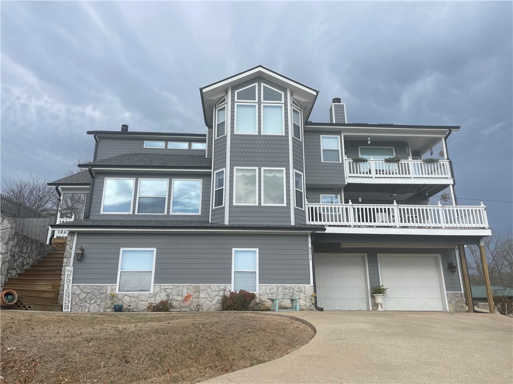 Is this a beautiful and luxurious lake home? Yes!!! It has five spacious bedrooms with 4 bathrooms, offering amenities perfect for entertaining or enjoying a quiet retreat while watching the sunrise on Beaver Lake. Just a few highlights to tickle your fancy: Commercial refrigerator, double oven, gas range and a warming drawer, but wait there is more, indoor salt pool with a hot tub, new roof and gutters installed in October of 2024, RV parking with power and sewer. A Tankless water heater to service the primary bath, and wait until you see the primary closet. This home is equipped with Solar Panels, so you can entertain while keeping your cost down. Did you say you wanted the opportunity to also produce income? Well, the covenants do not prevent you from having a wonderful Airbnb to host your next guest. Call me for a private showing.