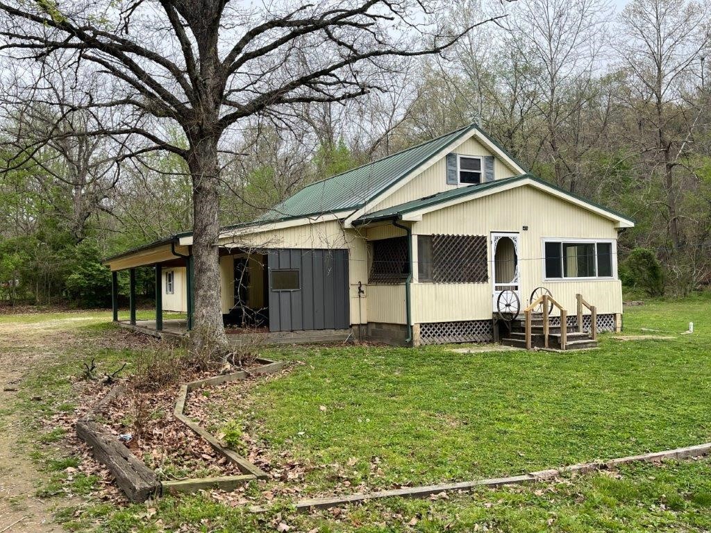 Farmhouse located just minutes from town. Level location surrounded by hillside. Attic area has been partially finished out for additional space. Large pole barn. Home is in need of total renovation. Great opportunity! Utilities are not on and water cannot be turned on for inspection. Sold AS-IS.