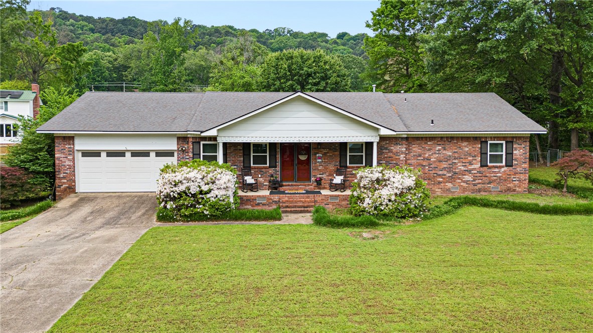 Welcome to 808 Knights Court in Russellville, located in the Camelot Village subdivision. This 3-bedroom, 2.5-bathroom home features a spacious living room with a cozy wood-burning fireplace, an eat-in kitchen, and a formal dining room that currently doubles as a home office. Enjoy updated flooring, windows, countertops, and fresh paint throughout. A convenient Jack-and-Jill bathroom connects the two guest bedrooms bedrooms and a half bath is easily accessible off the main living space. The home sits on a cul-de-sac and offers both covered and open back deck areasāperfect for relaxing or entertaining. A large laundry room and two-car garage add practicality. Just minutes from Sequoyah schools, the Russellville trail system, medical facilities, and city amenities, this one is a must-see!