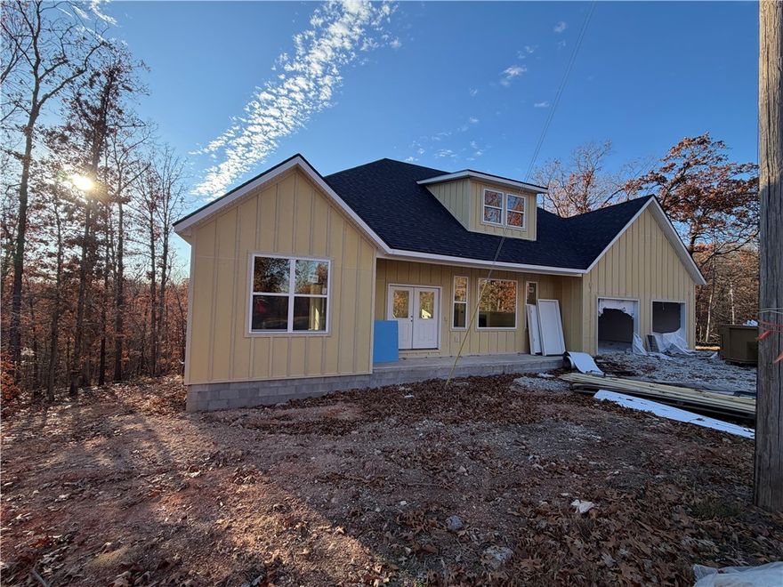 Seller to pay up to $5k towards Buyers Closing Costs & Prepaids AND provide a washer, dryer, and stainless steel refrigerator with full price offer. Kitchen has 2cm quartz & marble backsplash, along with stainless steel gas/propane cooktop, electric oven, microvent, & dishwasher. Living room has a gas/propane fireplace with ceramic tile surround. Ceiling fans throughout. Primary bedroom has bathroom suite with a separate tub & tiled shower, dual vanity sinks, and 2 cm quartz countertops. Disc lights, ceiling fans, and 2” faux wood blinds throughout the home.  Sodded front yard, seed & straw on the side & backyard.
Owner is related to a realtor. Owner is related to the builder. Builder is a licensed real estate agent with Crye-Leike Realtors of Siloam Springs. Taxes are based on the land only and will increase when re-assessed.