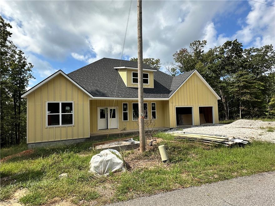 Seller to pay up to $5k towards Buyers Closing Costs & Prepaids AND provide a washer, dryer, and stainless steel refrigerator with full price offer. Kitchen has 2cm quartz & marble backsplash, along with stainless steel gas/propane cooktop, electric oven, microvent, & dishwasher. Living room has a gas/propane fireplace with ceramic tile surround. Ceiling fans throughout. Primary bedroom has bathroom suite with a separate tub & tiled shower, dual vanity sinks, and 2 cm quartz countertops. Disc lights, ceiling fans, and 2” faux wood blinds throughout the home.  Sodded front yard, seed & straw on the side & backyard.
Owner is related to a realtor. Owner is related to the builder. Builder is a licensed real estate agent with Crye-Leike Realtors of Siloam Springs. Taxes are based on the land only and will increase when re-assessed.