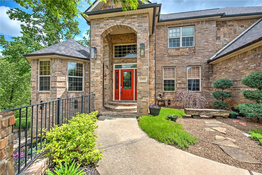 You’ll be swept away by this meticulously maintained 3-level home in the heart of Bentonville, where one beautiful room leads effortlessly to the next. This 6,000 sq ft beauty offers sweeping treed views and 2 expansive levels of decking—ideal for entertaining! Inside, enjoy beaming solid wood floors, extensive crown molding, high ceilings, and thoughtfully designed spaces including a private study & a gracious formal dining room perfect for hosting. Multiple living areas showcase gorgeous picture windows that flood the home with natural light and scenic views. The open eat-in kitchen features double ovens, a gas cooktop, & pantry. The main-level primary suite is spacious, private, & offers beautiful views. The stunning lower level offers a large family rm, fireplace, wet bar, 2nd primary suite, and a gym/6th bedroom. Walk-in closets throughout, move-in-ready, an incredible neighborhood, & a prime location just minutes from vibrant downtown Bentonville complete this exceptional home!