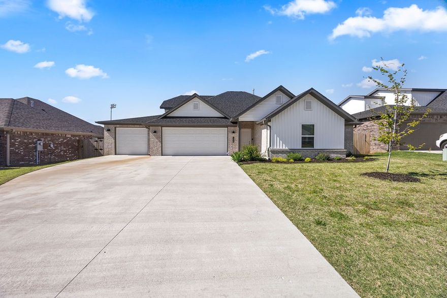 $3500 Preferred Lender Credit!!! This beautiful nearly new 4 BR 2 BA 3 car garage home is situated right in the heart of Prairie Grove! Walk to all of the downtown shops or use the trail to pass through to Rieff park; where you will find the Aquatic park, four 1st class baseball fields, paved walking trails, sand volleyball, and Murph skate facilities.  This home has a great open floor plan featuring a spacious living room with a gas fireplace, large kitchen, and dining area that is perfect for entertaining. The kitchen features granite countertops, a gas range, a coffee nook, and a pantry. In addition to the primary bedroom suite that connects to the laundry room, you will find two additional bedrooms downstairs and one large bedroom/bonus room upstairs. Outside you can enjoy coffee on your private screened in porch with only views of the park behind your home! The large back yard also has an extended deck platform, raised garden beds, and a large yard with room for endless activities! This gem won't last long!