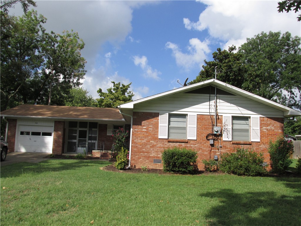 Great Location!!! Close to downtown Bentonville, huge corner lot with mature trees, 3 bedroom 2 bath home fresh paint and beautiful vinyl plank flooring in dining and living room and new carpet in bedrooms. 1 car garage.