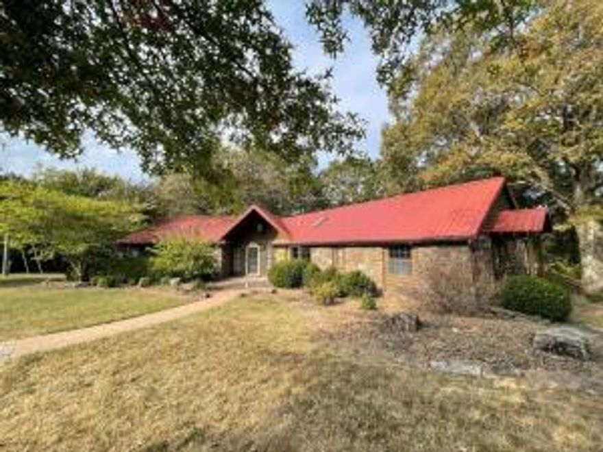 Idyllic East Fayetteville location w/cabin in the woods feel minutes from Fayetteville. Easy access to shopping,schools,Razorback games,I-40,public boat ramp. 4.17 +/- wooded acres w/ spectacular fall/winter views,barn,pond,recirculating stream,private gated entrance,in-ground pool/pool house,guest house w/appliances,play house for kids. Main house is 3 beds,3 full baths,cathedral ceiling & wood stove. Amazing gourmet kitchen w/copper hood,island,skylight,refrigerator & freezer included. Beautiful walk in tile showers,jetted tub & Gorgeous wood floors/ceilings,spacious laundry w/washer dryer. Huge sunroom w/HVAC,wrap around rear deck,large oaks/fruit trees & deer. Low Utilities,no city sewer or water bill! The well water is clean & tastes better than municipal water.