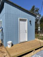 This property that is secluded and quiet at the end of the road has many possibilities. Nice place for a house in the woods or just a weekend getaway. The property has a seasonal creek, shooting range area, raised bed gardens and two small cabins or sheds that could be further developed.