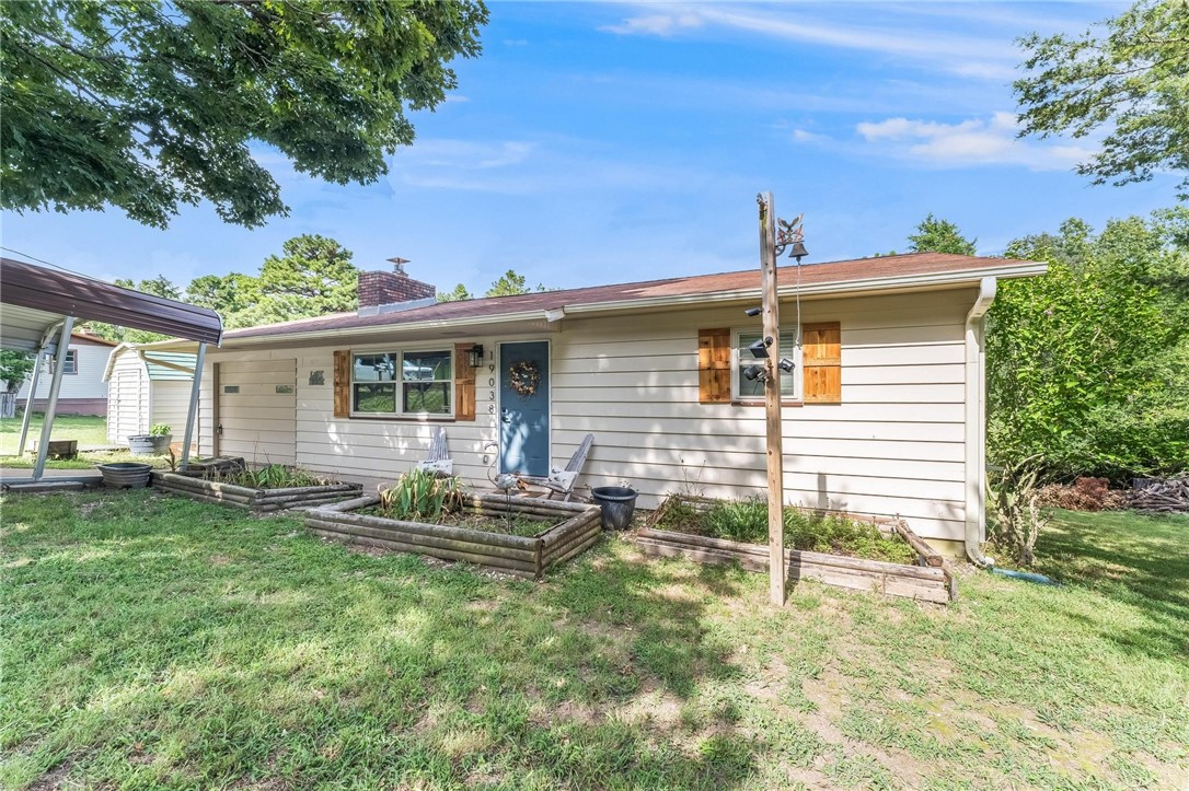 Welcome to this charming 2-bedroom, 1-bathroom home located in the vibrant city of Rogers, AR. This property boasts a cozy fireplace, perfect for those chilly evenings, and a sunroom that invites an abundance of natural light, creating a warm and inviting atmosphere. The home also features a covered parking area, ensuring your vehicle is protected from the elements. The covered patio is an ideal spot for outdoor dining or simply relaxing with a good book. The garden area is a gardener's dream, offering ample space for cultivating your favorite plants or creating your own vegetable patch. With its thoughtful layout and desirable amenities, this home offers a comfortable and convenient living experience.