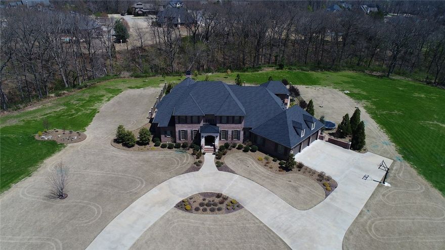 Estate Living! Stunning, immaculate, quality home, only 4 years old. Parade of Homes Winner- Best Kitchen, spacious with upgraded gourmet appliances. Open floor plan with wall of windows, covered patio to view nature, privacy, in ground salt water pool, pool house, outdoor fireplace, built in grill all on 3.8 acres. Spacious master suite, second master on the main level, all 5 bedrooms are ensuite. Media room. Side load 3 car garage for great curb appeal. Look no further. You are home