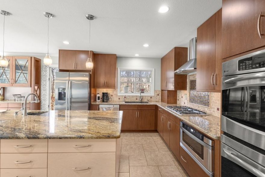 Storybook charm meets spacious living in the 2,598 SF cottage style home filled with natural light from large windows and skylights. The upgraded kitchen features granite counters, large island, stainless appliances, double ovens and gas cooktop. Enjoy upper and lower covered patios, a wood burning stove and 520 SF climate-controlled storage/workshop near Lake Rayburn.