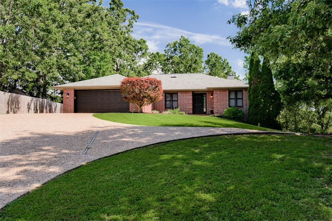 Beautiful 3,078 s.f. two-story home in a quiet neighborhood with a large, partially covered back deck offering stunning forest views—perfect for relaxing or entertaining. Bright open-concept main level with vaulted ceilings, wood-burning fireplace, surround sound, and updated kitchen with 2025 granite countertops, large stainless undermount sink, stainless appliances, and rollout shelves. Spacious primary suite with walk-in closet and luxurious en-suite bath featuring double sinks, large shower, and extra-large spa jetted tub. Main floor also has a guest bedroom with walk-in closet, an office with custom built-ins/closet, and a spacious laundry room with cabinetry, workspace, and skylight. Walkout basement includes two large bonus rooms, ¾ bath, extra closets, and patio with wooded views. Recent updates: new roof (2021), Energy Star AC/heat system with programmable thermostat (2023), new exterior lighting, luxury plank flooring in bedrooms, and fresh interior paint. Close to Scottsdale Golf Course.