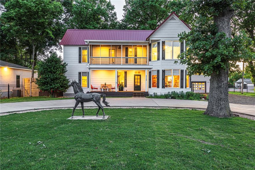 Gorgeous & maintained 4 bed, 3.5 bath Folk-Victorian style estate blending classic character w/ updates is in a premier location near I-49, U of A Campus & bus stops, & Downtown Fayetteville! Gated entry & iron fence welcome you to circle drive & 2-story porch. Head inside to foyer w/ wood floors & fireplace. Spacious formal dining space w/ built-ins & bay window connect to updated kitchen w/ new cabinetry, granite, tiled backsplash, & stainless steel apps incl gas range w/ eat-in dining! Sunken living w/ built-in shelves! Main floor primary suite w/ fireplace, updated ensuite w/ tiled walk-in shower, & private screened in porch! Upstairs bonus space, 2nd story porch access & 3 bedrms, 2 baths! Screened-in patio perfect for the hosting! Large backyard w/ mature trees & wood fence for privacy @ adjoining properties! Covered carport with stain-glass details! Detached 2-car garage w/ 697 sqft 1 bedrm 1 bathrm apartment above for income generation or guests! Don’t miss out on this hard to find gem! Act now!