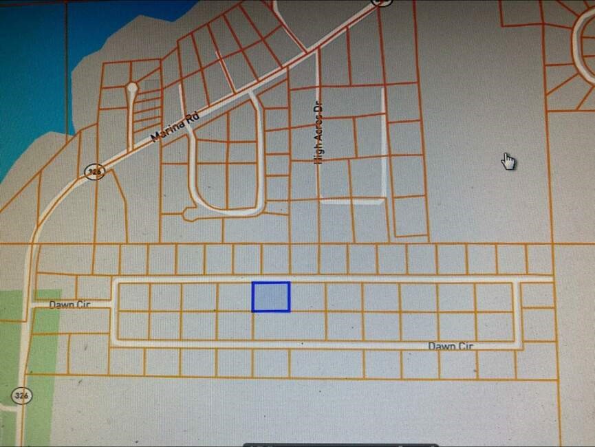 Discover the perfect opportunity with this 0.58-acre lot located right on the edge of town, offering a harmonious blend of convenience and natural beauty. Just a short distance from the lake, this property is ideal for those who enjoy outdoor activities like boating, fishing, or simply relaxing by the water. The spacious lot provides ample room for building your dream home, a vacation retreat, or even an investment property. With easy access to utilities and local amenities, this land is ready for development and full of potential. Enjoy the peace and quiet of lakeside living while staying close to town for all your daily needs. Don't miss out on this rare opportunity to own a piece of prime land--contact us today for more information or to schedule a viewing!